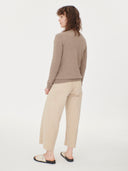 back up front view of a woman wearing a beige v-neck cardigan and pants  #color_taupe