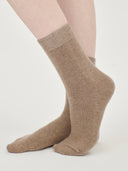 close up of taupe colored socks worn by person #color_taupe