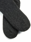 close up of dark gray socks with patterns on a light gray background #color_charcoal