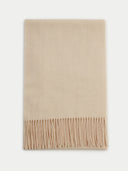 A beige fringed scarf with a lightweight twill weave, displayed on a neutral background.