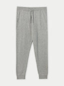 A pair of men's cashmere joggers in gray, featuring a ribbed texture, adjustable waistband with drawstrings, and side pockets. #color_vapor-blue
