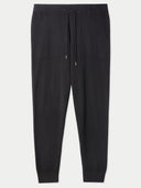 A pair of men's cashmere jogger pants in black color with a drawstring waistband. #color_black