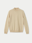 A beige cashmere mock neck sweater with ribbed cuffs, displayed on a plain background. #color_beige